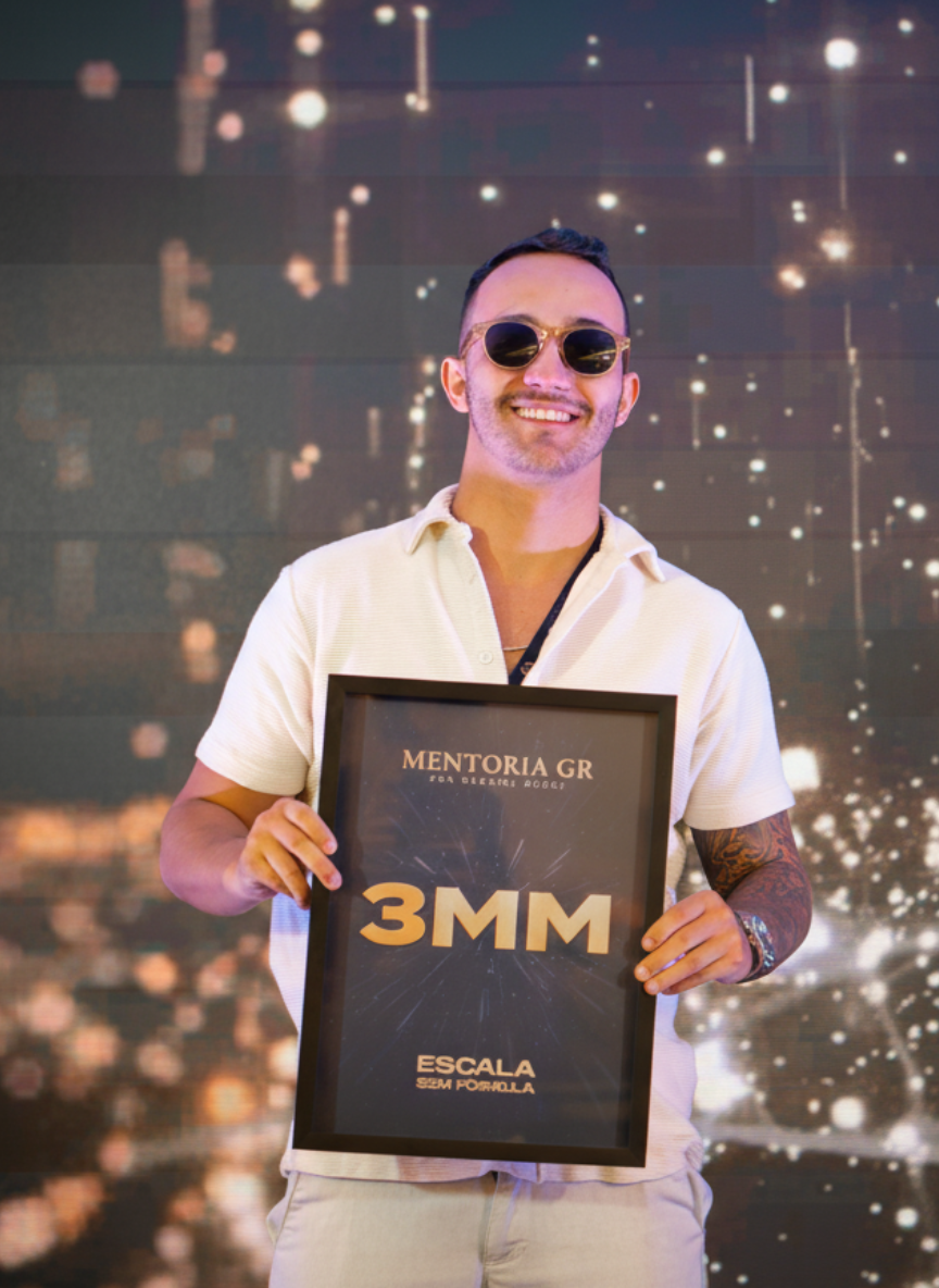 3MM achievement plaque from Mentoria GR on stage with sparkly background